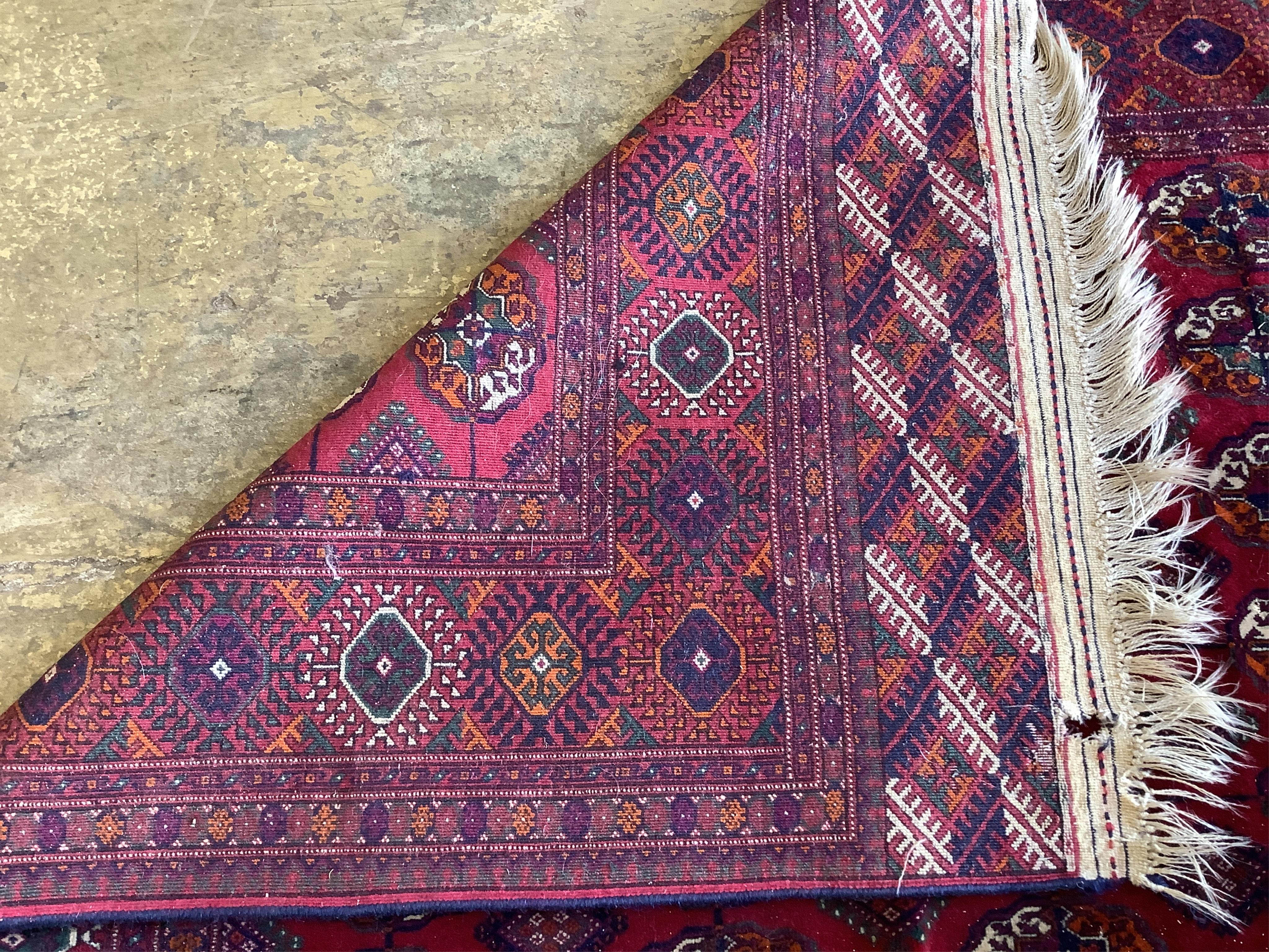 A modern Bokhara red ground rug, 253 x 165cm. Condition - good